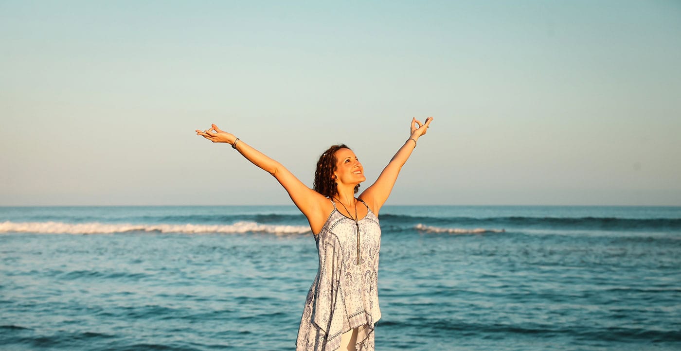woman standing in front of the ocean
